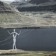 Illustration for article titled These Beautiful Giant Sculptures Support Power Lines With Style